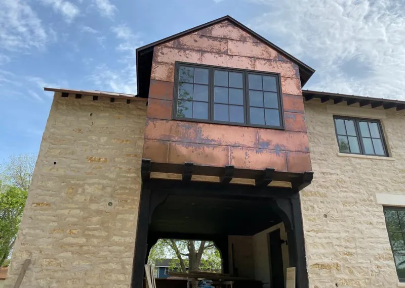 Copper metal panel facade on a stone building for Metal Roof Coating in Pocahontas